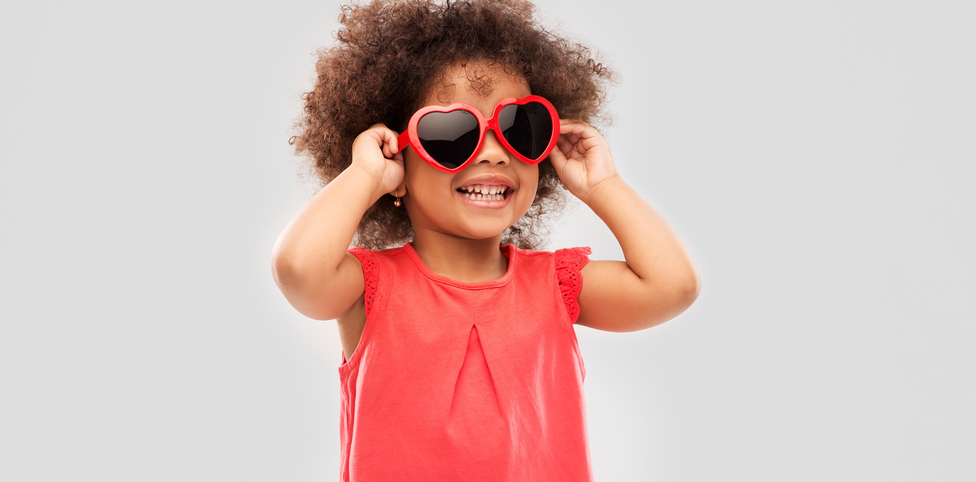Pediatric Digital X-Ray - Young girl with heart shaped sunglasses.